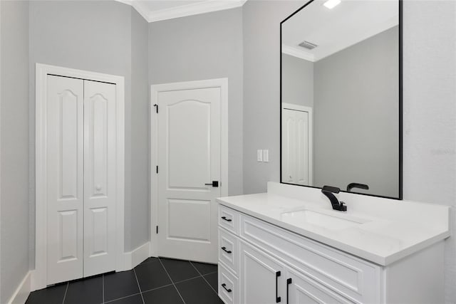 600 Eagle Watch Ln, Osprey, FL 34229 - bathroom with crown molding, vanity, and tile patterned floors