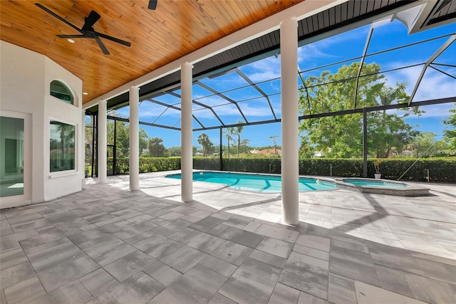 600 Eagle Watch Ln, Osprey, FL 34229 - view of swimming pool featuring ceiling fan, a patio, glass enclosure, and a pool with connected hot tub