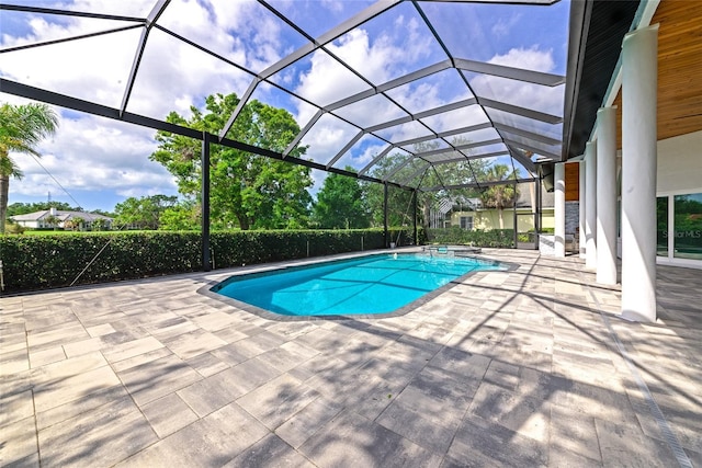 600 Eagle Watch Ln, Osprey, FL 34229 - view of swimming pool with a patio, a pool with connected hot tub, and glass enclosure