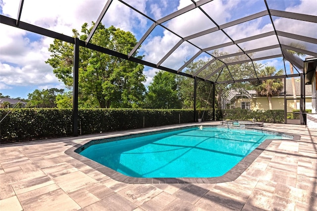 600 Eagle Watch Ln, Osprey, FL 34229 - view of pool featuring a patio, a pool with connected hot tub, and glass enclosure