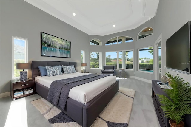 600 Eagle Watch Ln, Osprey, FL 34229 - bedroom featuring a raised ceiling, light carpet, a high ceiling, and recessed lighting