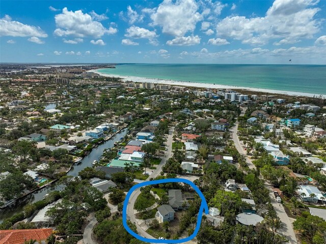aerial perspective of suburban area featuring expansive beach