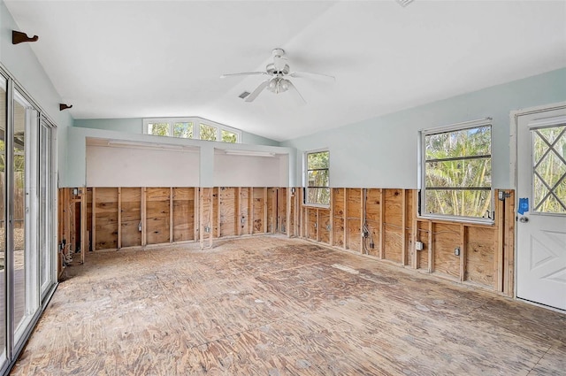 spare room with vaulted ceiling and a ceiling fan