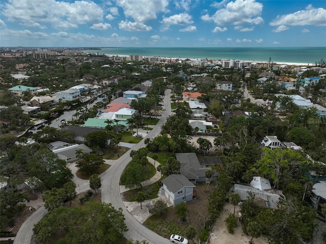 aerial view of residential area featuring a nearby body of water