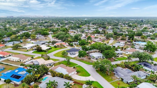 birds eye view of property with a residential view