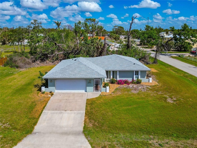 8152 Seashell St, Englewood, FL 34224 - ranch-style house featuring a garage, concrete driveway, stucco siding, and a front yard