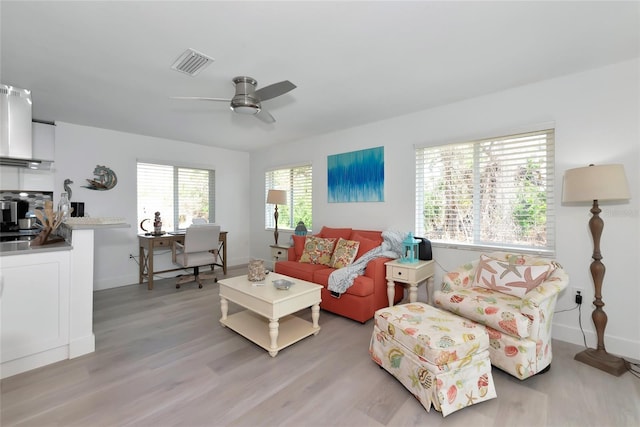 8152 Seashell St, Englewood, FL 34224 - living area featuring a desk, ceiling fan, light wood-type flooring, and baseboards