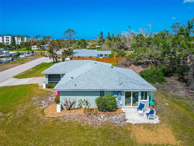 8152 Seashell St, Englewood, FL 34224 - back of property featuring roof with shingles and a patio area
