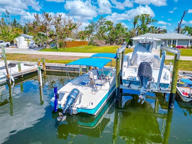8152 Seashell St, Englewood, FL 34224 - dock featuring boat lift and a water view
