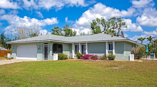 8152 Seashell St, Englewood, FL 34224 - single story home featuring stucco siding, a garage, a front yard, and driveway