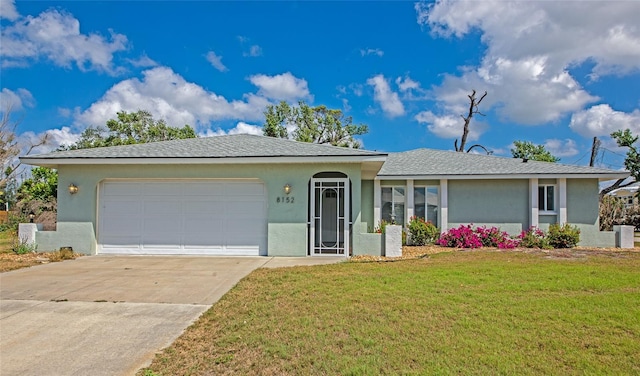 8152 Seashell St, Englewood, FL 34224 - ranch-style home featuring a front yard, stucco siding, driveway, and a garage