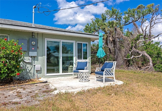 8152 Seashell St, Englewood, FL 34224 - rear view of house featuring a patio and a lawn