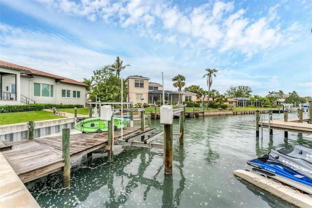 dock area featuring a water view, a residential view, and boat lift
