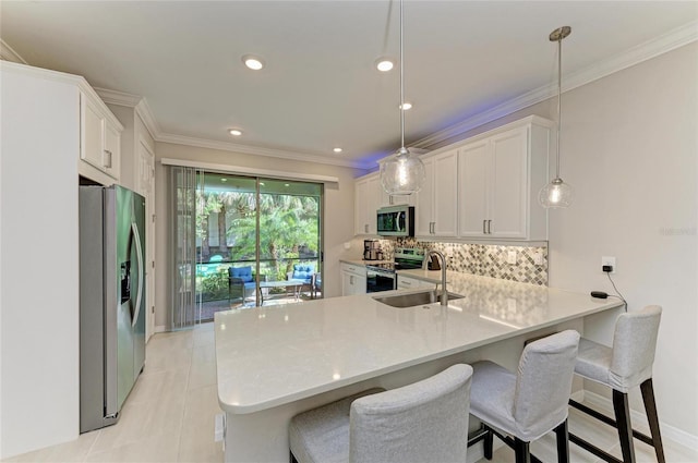 224 Soliera St, Nokomis, FL 34275 - kitchen with tasteful backsplash, light countertops, a sink, and appliances with stainless steel finishes