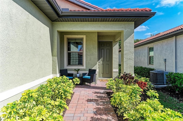 224 Soliera St, Nokomis, FL 34275 - entrance to property featuring stucco siding, a tile roof, and central AC