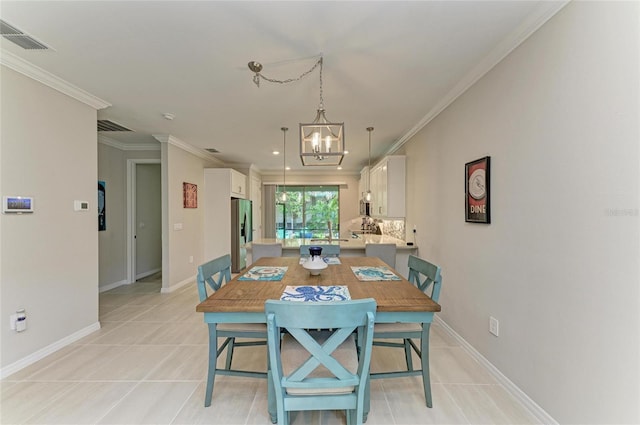 224 Soliera St, Nokomis, FL 34275 - dining area with visible vents, ornamental molding, and light tile patterned flooring