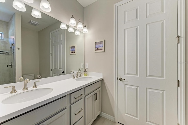 224 Soliera St, Nokomis, FL 34275 - bathroom featuring toilet, double vanity, a sink, and a shower stall