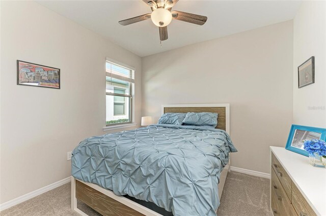 224 Soliera St, Nokomis, FL 34275 - bedroom with baseboards, ceiling fan, and light colored carpet