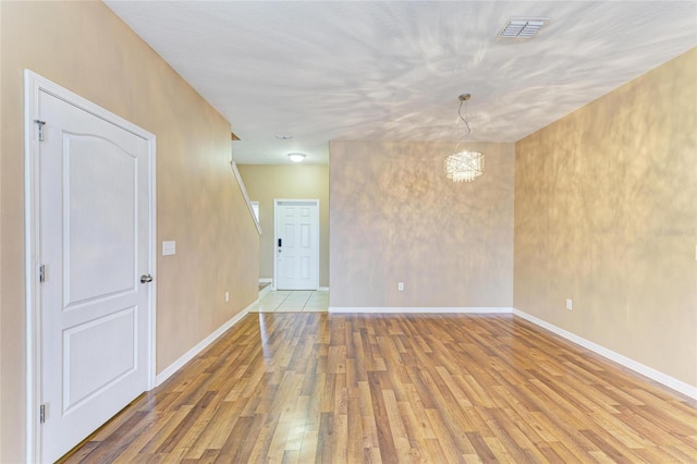 1912 Hawks View Dr, Ruskin, FL 33570 - unfurnished room featuring light wood-style floors, baseboards, and visible vents