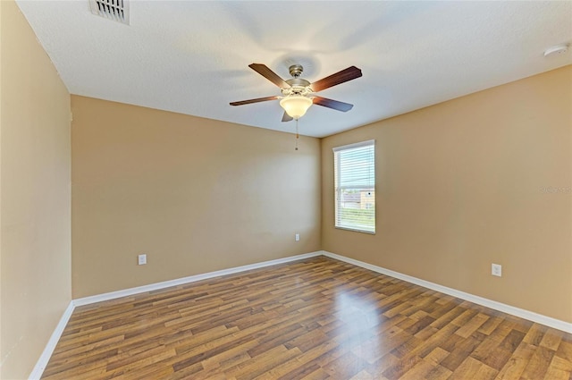 1912 Hawks View Dr, Ruskin, FL 33570 - unfurnished room with visible vents, ceiling fan, baseboards, and wood finished floors