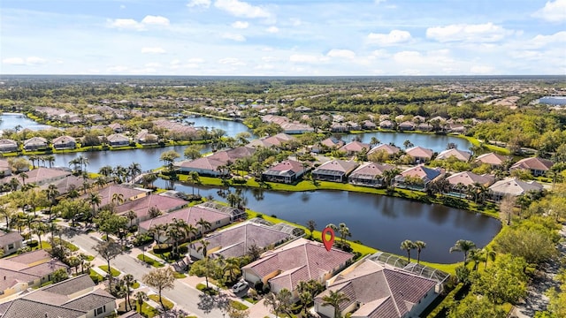 aerial view with a water view and a residential view