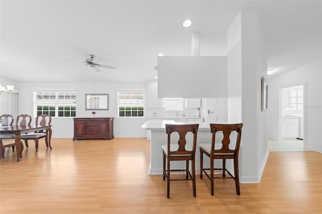dining area featuring recessed lighting, baseboards, a ceiling fan, and light wood-style floors