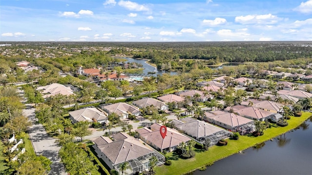 bird's eye view with a residential view and a water view