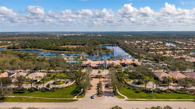 aerial view featuring a water view, a residential view, and a forest view