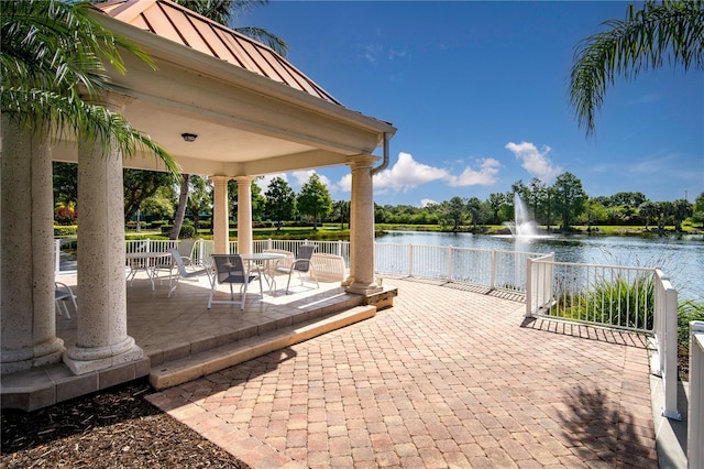 view of patio / terrace featuring a gazebo and a water view