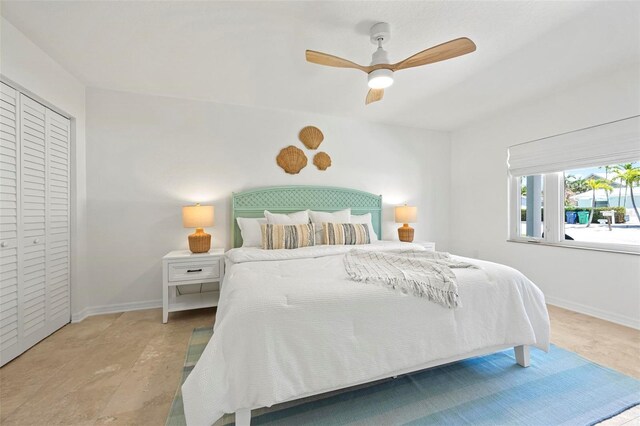 bedroom featuring baseboards and a ceiling fan