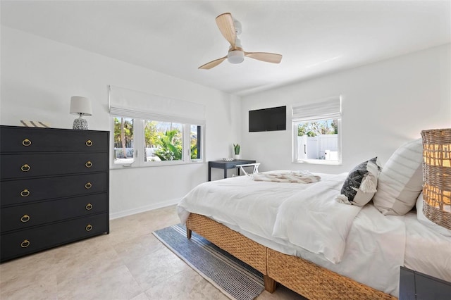 bedroom featuring baseboards and a ceiling fan