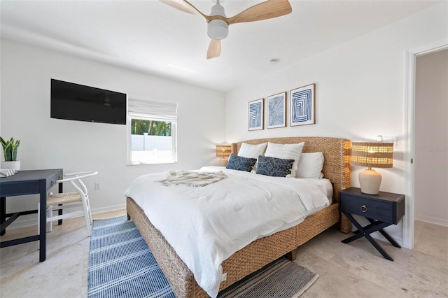 bedroom with baseboards and ceiling fan