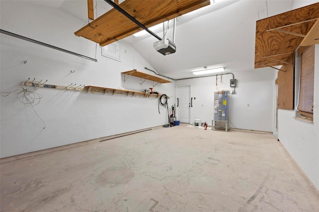 garage featuring electric water heater and a garage door opener