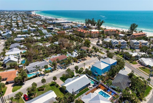 aerial view featuring a beach view, a residential view, and a water view
