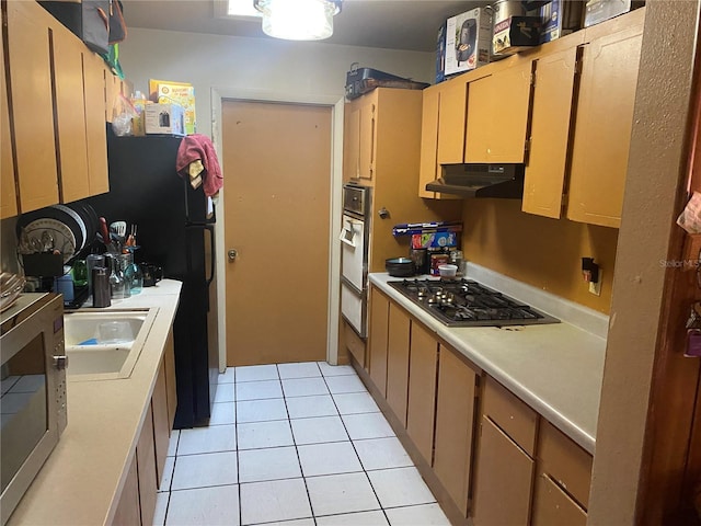 6324 Case Ave, Bradenton, FL 34207 - kitchen featuring stainless steel appliances, under cabinet range hood, light countertops, and light tile patterned flooring