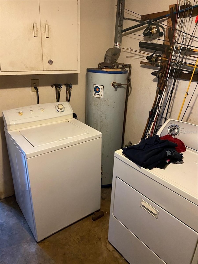 6324 Case Ave, Bradenton, FL 34207 - washroom featuring gas water heater, washing machine and clothes dryer, and cabinet space