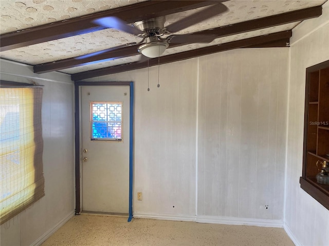 6324 Case Ave, Bradenton, FL 34207 - unfurnished room featuring ceiling fan, beamed ceiling, and wood walls