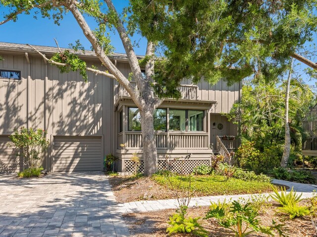1493 Landings Lake Dr Unit 32, Sarasota, FL 34231 - view of front of house with an attached garage and decorative driveway