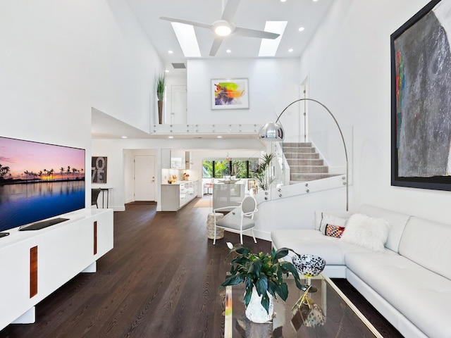 1493 Landings Lake Dr Unit 32, Sarasota, FL 34231 - living room featuring recessed lighting, wood finished floors, a high ceiling, and a skylight