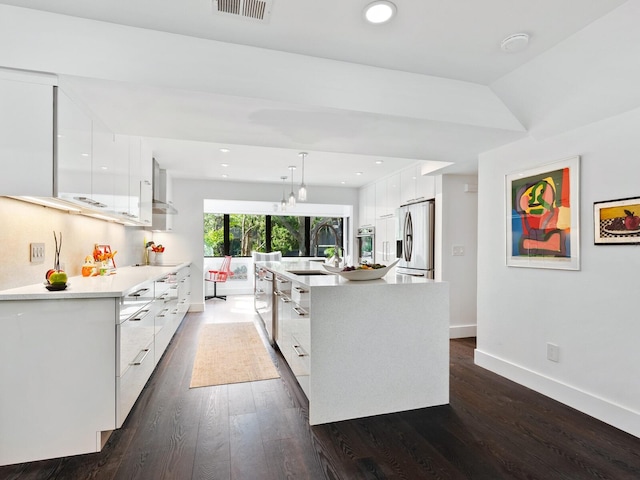 1493 Landings Lake Dr Unit 32, Sarasota, FL 34231 - kitchen with modern cabinets, white cabinetry, stainless steel appliances, and visible vents