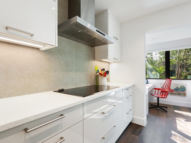 1493 Landings Lake Dr Unit 32, Sarasota, FL 34231 - kitchen featuring wall chimney exhaust hood, dark wood-style floors, backsplash, white cabinetry, and black electric stovetop