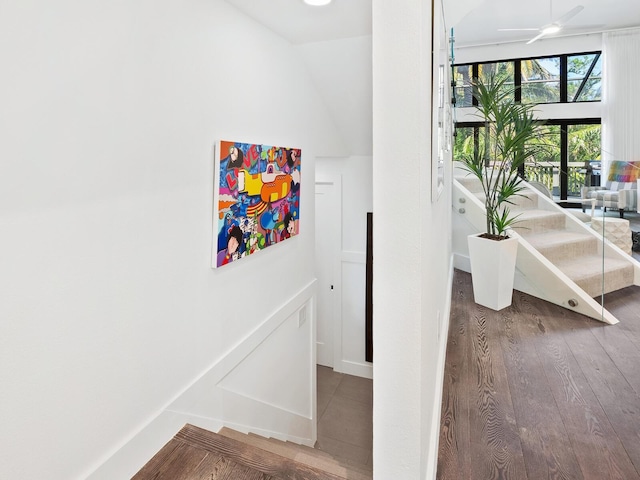 1493 Landings Lake Dr Unit 32, Sarasota, FL 34231 - stairway featuring a ceiling fan, wood finished floors, and vaulted ceiling