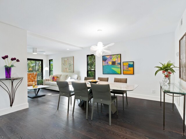 1493 Landings Lake Dr Unit 32, Sarasota, FL 34231 - dining room with baseboards, a wealth of natural light, and dark wood-style floors