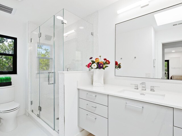 1493 Landings Lake Dr Unit 32, Sarasota, FL 34231 - bathroom with a shower stall, toilet, vanity, and visible vents