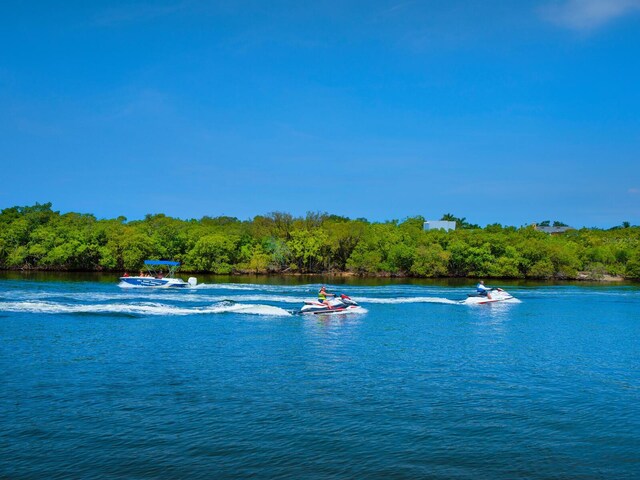 1493 Landings Lake Dr Unit 32, Sarasota, FL 34231 - water view featuring a forest view