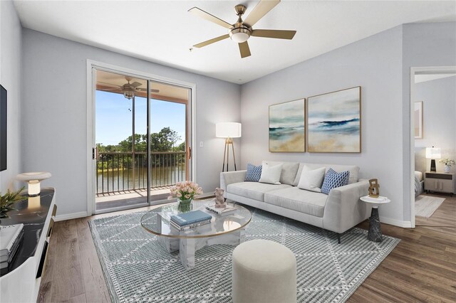 living room with wood finished floors, ceiling fan, and baseboards
