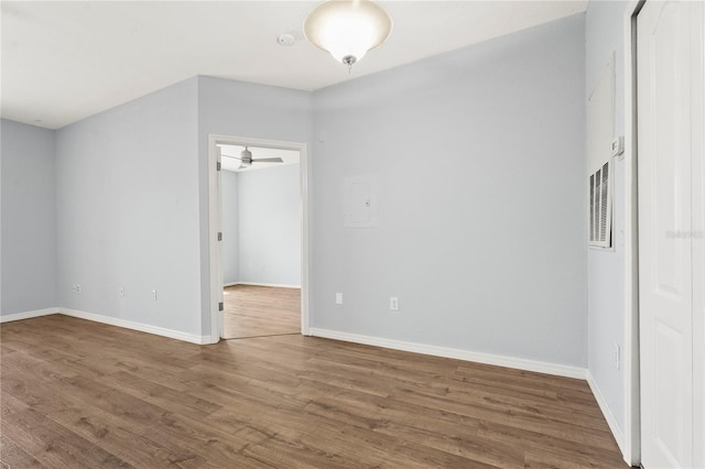 unfurnished bedroom featuring a closet, baseboards, and wood finished floors