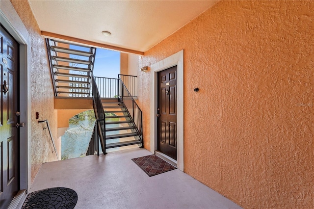 entrance to property featuring stucco siding