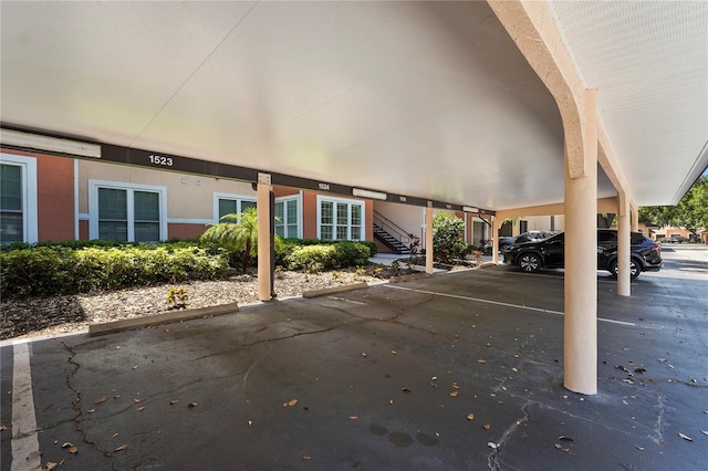 covered parking lot with stairway