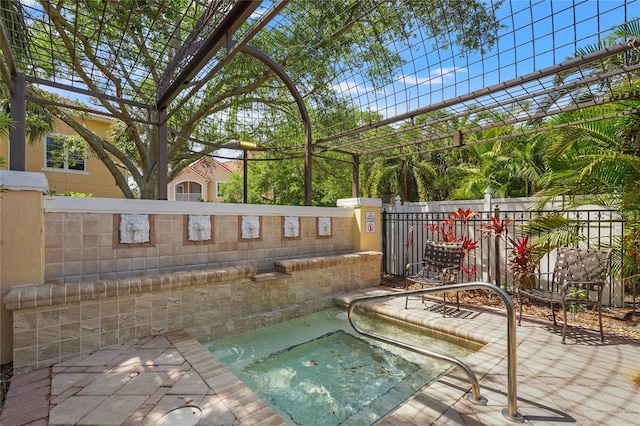 view of pool with a pergola, a patio area, and fence